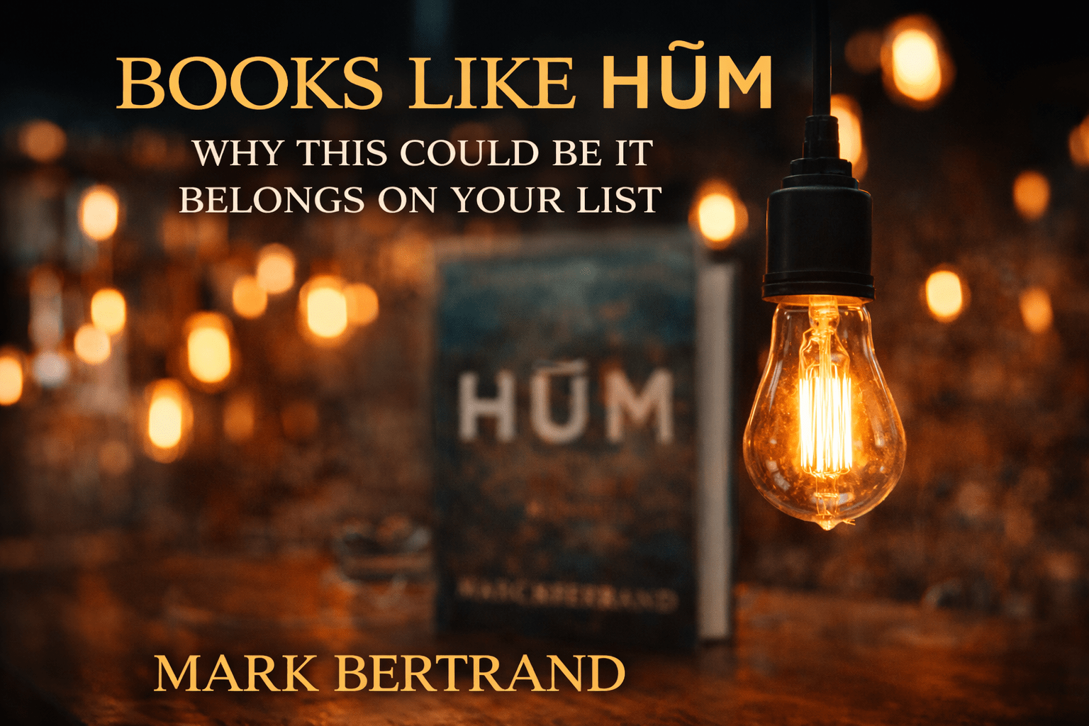 books like hum image of a glowing Edison bulb hanging in the right foreground. The bulb throws amber light across a dark, blurred background filled with soft orange bokeh, while a defocused copy of HŪM sits behind it at center-left.